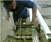 Making the mats - inserting rubber strips into aluminium profile